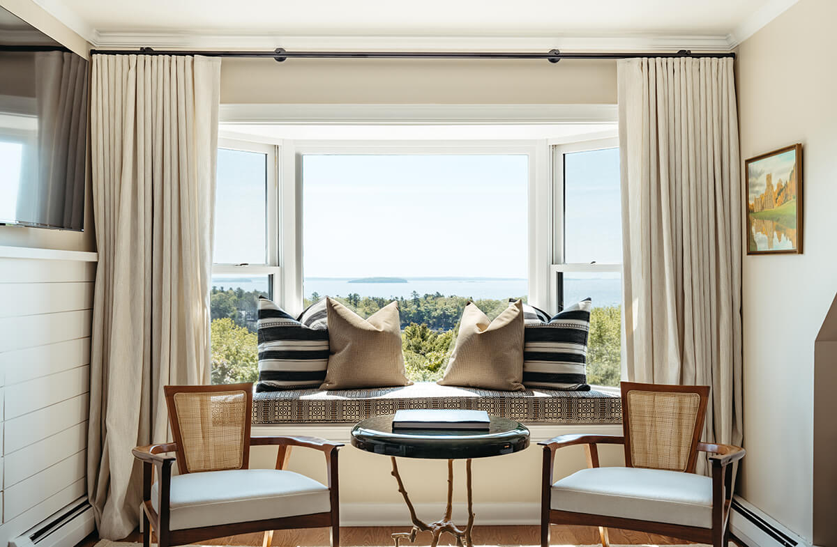 Seating area with water view in penthouse suite
