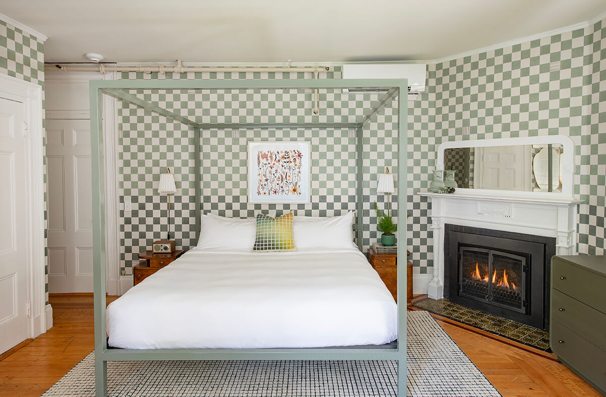 Sandringham guestroom view of bed and fireplace
