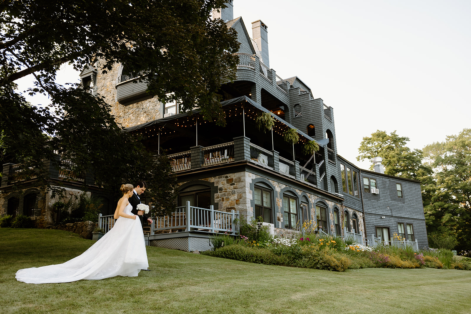 newly married couple walking on lawn